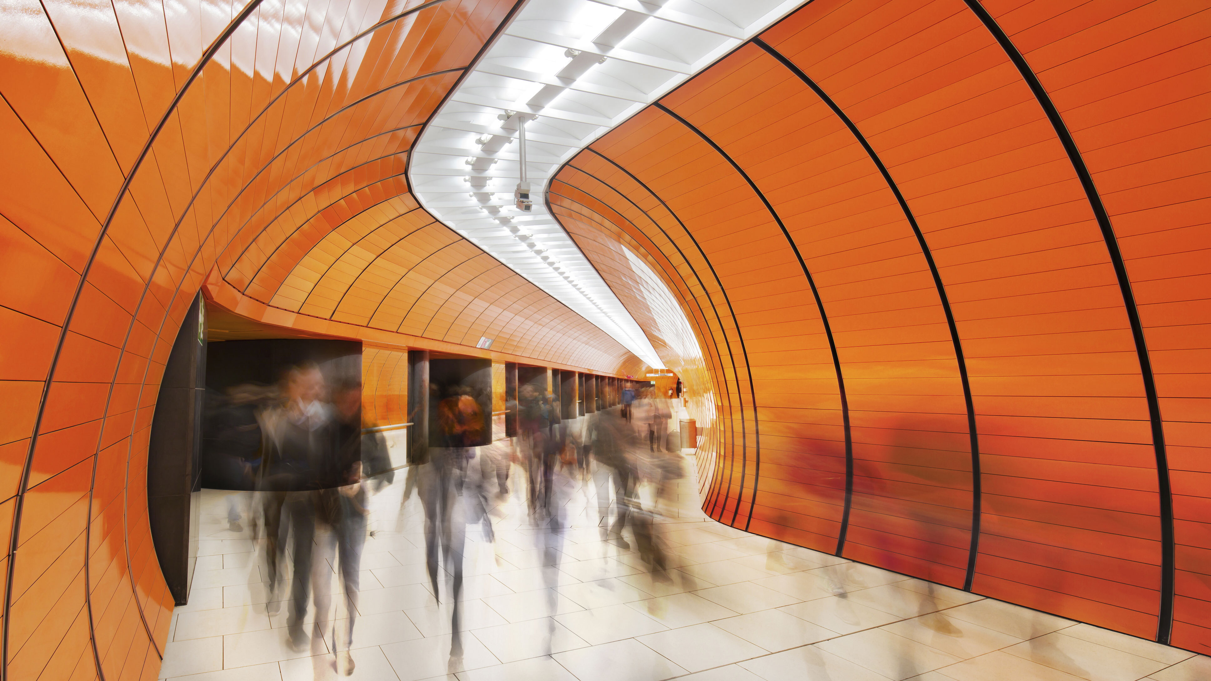 I Stock 693280510 IW EDIT Orange Tunnel people walking